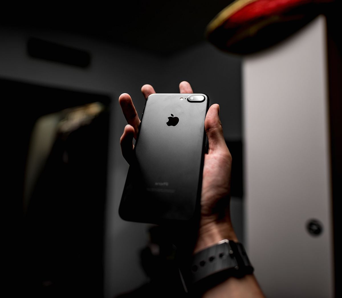 a person holding an iphone in their hand